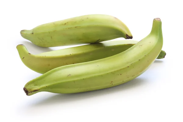 Fresh plantain bunches in a wooden crate